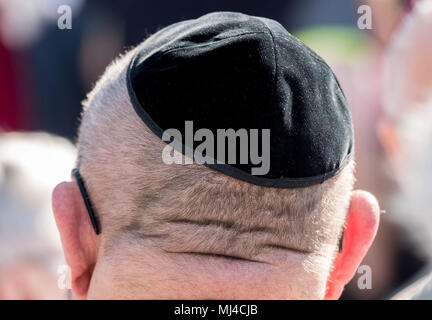04 May 2018, Germany, Hanover: A man wearing a kippah at the Kippah Walk which is demonstrating solidarity with Jewish citizens. Photo: Peter Steffen/dpa Stock Photo