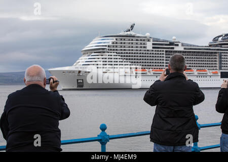 Ocean Terminal, Greenock, United Kingdom, Friday 4th May 2018. Crowds gather on Greenocks Esplanade as the MSC Meraviglia cruise ship departs The Ocean Terminal. The 316m 171,598 ton cruise ship is the longest to have ever visited the Clyde. After departing the next destination is Dublin in Ireland. Stock Photo