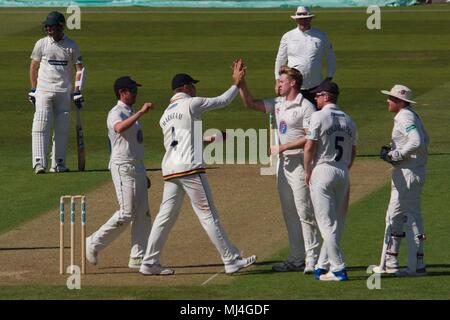 Chester le Street, England, 4 May 2018. Aiden Markram of Durham high fives bowler Barry McCarthy after he took the wicket of Michael Carberry of Leicestershire in the Specsavers County Championship match at Emirates Riverside. Credit: Colin Edwards/Alamy Live News. Stock Photo