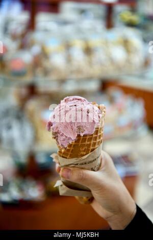 Blackberry ice cream served in a waffle cone Stock Photo