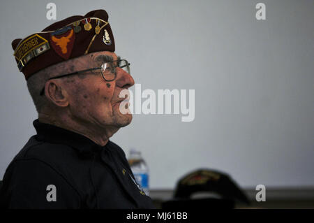 Paul Kerchum, a Chief Master Sgt. (Ret.) with the Air Force and the Army Air Corps, recalls a moment while describing his experiences in World War II and his survival of the Bataan Death March at White Sands Missile Range, New Mexico, March 24, 2018.  Kerchum addressed a crowd who gathered to hear his and six other survivors’ experiences with the Bataan Death March, and to support the 2018 Bataan Memorial Death March, a 26.2-mile race which honors those who defended the Philippines during World War II.  (U.S. Army Image collection celebrating the bravery dedication commitment and sacrifice of  Stock Photo