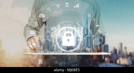 Network connection security system. Businessman using digital tablet and security lock technology icon Stock Photo