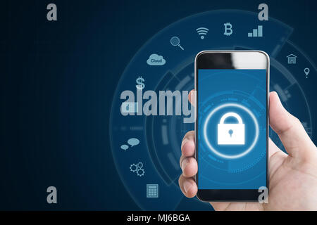 Mobile device security system. Hand holding mobile smart phone with lock and application icons. on blue background Stock Photo