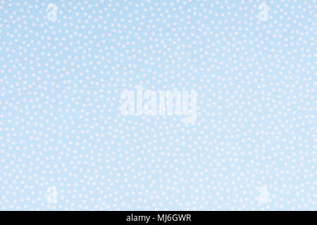 Bright blue paper with white spots and dots texture background. Stock Photo