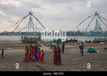 Kochi (Cochin), Kerala / India - April 15 2018: Fishing nets are lying empty on a beach in Cochin (Kochi) next to Chinese fishing nets (Cheena vala) o Stock Photo
