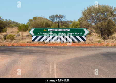 Lasseter Highway road sign directions to Stuart Highway and Uluru (Ayers Rock) Stock Photo