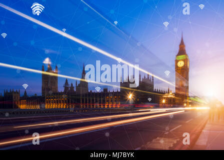 Hand holding smart phone and city with network connection. Smart city network connection concept. Stock Photo
