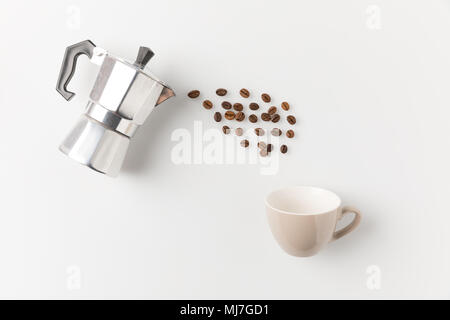 coffee beans pouring from pot Stock Photo