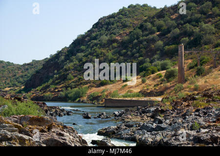 River Guadiana before the Pulo do Lobo (Wolf's leap) waterfall and the remnants of ancient Roman aqueduct. Guadiana river valley Natural park, Alentej Stock Photo