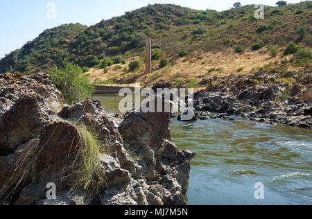 River Guadiana before the Pulo do Lobo (Wolf's leap) waterfall and the remnants of ancient Roman aqueduct. Guadiana river valley Natural park, Alentej Stock Photo