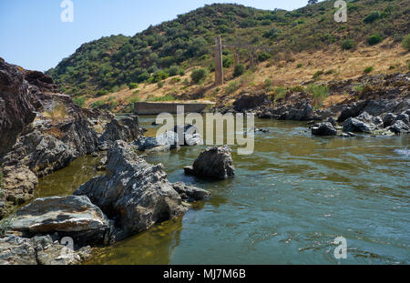 River Guadiana before the Pulo do Lobo (Wolf's leap) waterfall and the remnants of ancient Roman aqueduct. Guadiana river valley Natural park, Alentej Stock Photo