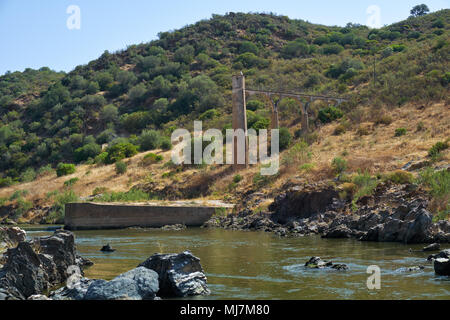 River Guadiana before the Pulo do Lobo (Wolf's leap) waterfall and the remnants of ancient Roman aqueduct. Guadiana river valley Natural park, Alentej Stock Photo