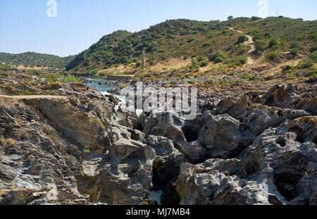 Pulo do Lobo (Wolf's leap) waterfall is a cascades of river Guadiana which water finds its way through limestone rocks, Guadiana river valley Natural  Stock Photo