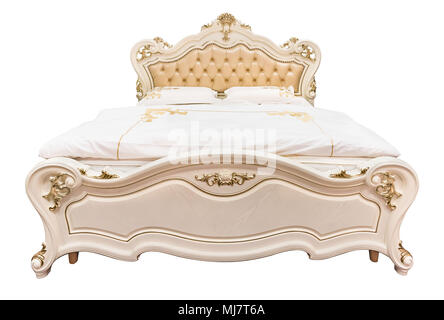 Luxury beige classical bed furniture with patterned bed with leather upholstery capitone texture headboard. Soft velour fabric bedclothes. Classic mod Stock Photo