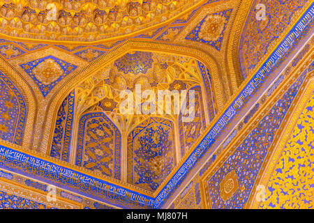 SAMARKAND, UZBEKISTAN - AUGUST 28, 2016: Detail of gold mosaic dome in Tilya Kori Madrasah in Samarkand, Uzbekistan Stock Photo