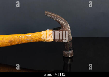 an old and heavily used carpenters claw hammer Stock Photo