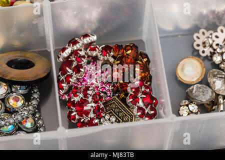a collection of colored nine stone buttons used to create jewelry Stock Photo