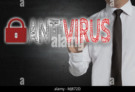 Antivirus is written by businessman on screen. Stock Photo