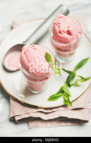 Homemade strawberry yogurt ice cream in glasses Stock Photo