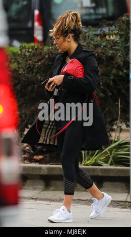 Caroline Flack heads to the gym wearing a Burberry raincoat and Ray-Ban aviator sunglasses and carrying a Gucci handbag  Featuring: Caroline Flack Where: London, United Kingdom When: 03 Apr 2018 Credit: WENN.com Stock Photo