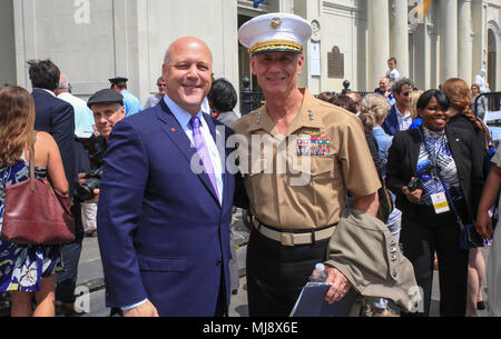 Lt. Gen. Rex C. McMillian (right), commanding general of Marine Forces Reserve and Marine Forces North, and Mitch Landrieu (left), mayor of New Orleans, pose for a photo following the New Orleans tricentennial ceremony in the French Quarter, New Orleans, April, 21, 2018. Service members and distinguished visitors from around the world gathered in the French Quarter to help celebrate the culture and history of New Orleans during the New Orleans Tricentennial ceremony. (U.S. Marine Corps photo by Lance. Cpl. Samantha Schwoch/released) Stock Photo