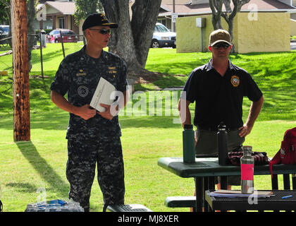 PEARL HARBOR-- (April 21, 2018) Capt. Jeff Bernard, commander of Joint Base Pearl Harbor-Hickam provides opening remarks to Radford High School JROTC cadets, military and their families along with the local community before a clean up at the ancient fishpond, Loko Pa’aiau, at McGrew Point Navy housing on Oahu. The fishpond restoration started September 2014 and forges a continuing partnership by the U.S. Navy and the local community to restore ancient Hawaiian relics onboard Joint Base Pearl Harbor-Hickam. (U.S. Navy photo by Airman Joshua Markwith) Stock Photo