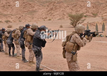 CAMP TITIN, Jordan (April 21, 2018) – U.S. Marines with Fleet Antiterrorism Security Team – Central Command and Jordanian 77th Marines Battalion conduct  live-fire exercises during exercise Eager Lion 2018, April 21.  Eager Lion is a capstone training engagement that provides U.S. forces and the Jordan Armed Forces an opportunity to rehearse operating in a coalition environment and to pursue new ways to collectively address threats to regional security and improve overall maritime security.  (U.S. Navy photo by Mass Communication Specialist 1st Class Sandi Grimnes Moreno/released) Stock Photo