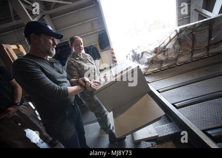 Country music artist Craig Morgan checks out the 730th Air Mobility Squadron logistics warehouse at Yokota Air Base, Japan; the first stop on the annual Vice Chairman’s USO Tour, April 22, 2018. Comedian Jon Stewart, country music artist Craig Morgan, celebrity chef Robert Irvine, professional fighters Max “Blessed” Holloway and Paige VanZant, and NBA Legend Richard “Rip” Hamilton will join Gen. Selva on a tour across the world as they visit service members overseas to thank them for their service and sacrifice. (DoD Photo by U.S. Army Sgt. James K. McCann) Stock Photo