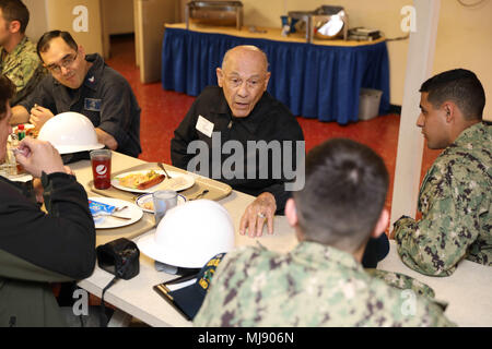 180420-N-VO895-0130 NORFOLK, Va. (April 20, 2018) -- Korean War veteran, Duane Trowbridge eats lunch with Sailors aboard amphibious assault ship USS Bataan (LHD 5), during a tour of the ship and commemoration of the 76th Battle of Bataan and Bataan Death March anniversary. Bataan is moored at BAE Systems Norfolk Ship Repair conducting a scheduled maintenance availability. (Navy Photo by Seaman Danilo Reynoso) Stock Photo