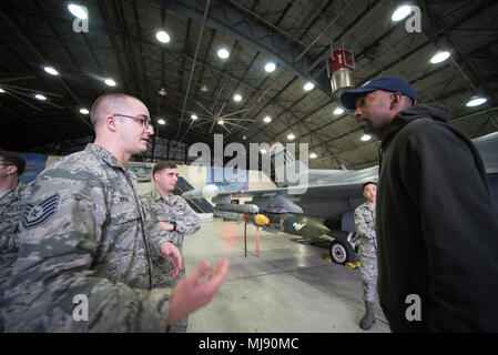 Entertainers check out a 51st Fighter Wing F-16 at Osan Air Base, Republic of Korea; the second stop on the annual Vice Chairman's USO Tour, April 23, 2018. Comedian Jon Stewart, country music artist Craig Morgan, celebrity chef Robert Irvine, professional fighters Max “Blessed' Holloway and Paige VanZant, and NBA Legend Richard “Rip' Hamilton will join Gen. Selva on a tour across the world as they visit service members overseas to thank them for their service and sacrifice. (DoD Photo by U.S. Army Sgt. James K. McCann) Stock Photo