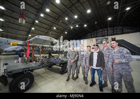 Entertainers check out a 51st Fighter Wing aircraft and munitions at Osan Air Base, Republic of Korea; the second stop on the annual Vice Chairman's USO Tour, April 23, 2018. Comedian Jon Stewart, country music artist Craig Morgan, celebrity chef Robert Irvine, professional fighters Max “Blessed' Holloway and Paige VanZant, and NBA Legend Richard “Rip' Hamilton will join Gen. Selva on a tour across the world as they visit service members overseas to thank them for their service and sacrifice. (DoD Photo by U.S. Army Sgt. James K. McCann) Stock Photo