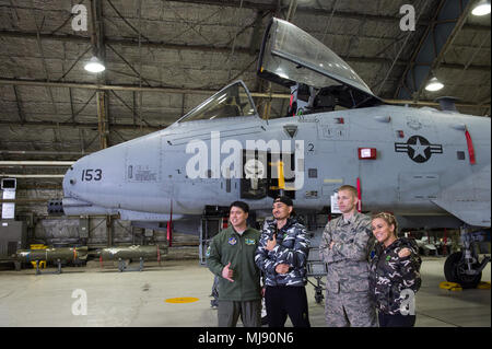 Entertainers check out a 51st Fighter Wing A-10 at Osan Air Base, Republic of Korea; the second stop on the annual Vice Chairman's USO Tour, April 23, 2018. Comedian Jon Stewart, country music artist Craig Morgan, celebrity chef Robert Irvine, professional fighters Max “Blessed' Holloway and Paige VanZant, and NBA Legend Richard “Rip' Hamilton will join Gen. Selva on a tour across the world as they visit service members overseas to thank them for their service and sacrifice. (DoD Photo by U.S. Army Sgt. James K. McCann) Stock Photo