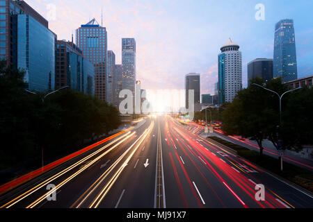 Light trails on the street at Beijing Central Business district at night in Beijing ,China. Stock Photo