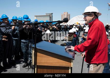 180420-N-GB113-0119 NORFOLK, Va. (April 20, 2018) - Battle of Bataan survivor and POW, Dan Crawley, speaks to the crew of the amphibious assault ship USS Bataan (LHD 5) during an All Hands call on the flight deck in commemoration of the 76th anniversary of the Battle of Bataan and Bataan Death March. Bataan is moored at BAE Systems Norfolk Ship Repair conducting a scheduled maintenance availability. (U.S. Photo by Mass Communication Specialist 3rd Class Zachariah Grabill/ Released). Stock Photo