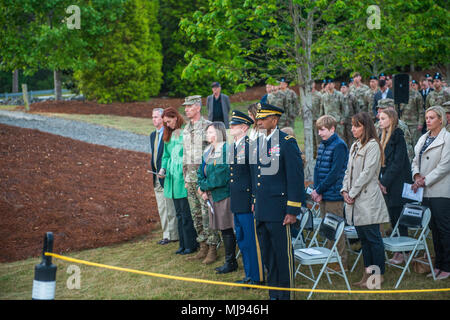 FORT BENNING, Ga. (April 25, 2018 ) Attendees at the Australian and New Zealand Army Corps Day Dawn Service stand during the playing of Amazing Grace, April 25, at the 173rd Airborne Brigade Memorial at the National Infantry Museum. The ceremony commemorated the 103rd anniversary of the storming onto the Gallipoli peninsula by the Australian and New Zealand Army Corps in the Dardanelles Campaign during World War I. (U.S. Army photo by Patrick A. Albright) Stock Photo