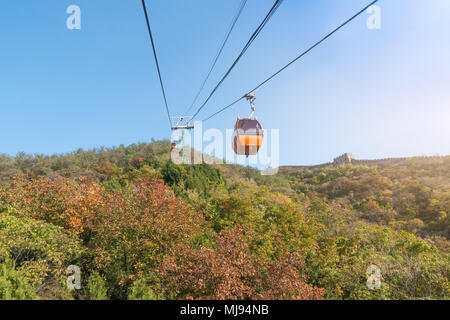 Cable car taking visitors up to the Mutianyu section of the Great Wall of China located in Huairou Country northeast of Central Beijing. Stock Photo