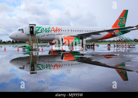 Kalibo Airport, Panay Island, The Philippines - November 11, 2010: Zest Air commercial passenger airliner parked on the runway of Kalibo airport durin Stock Photo