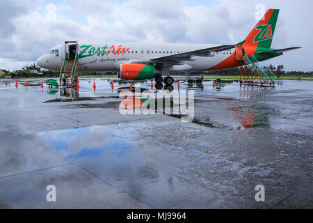 Kalibo Airport, Panay Island, The Philippines - November 11, 2010: Zest Air commercial passenger airliner parked on the runway of Kalibo airport durin Stock Photo