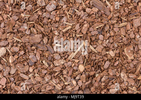 A background image of wood chip used for safety in toddlers playgrounds Stock Photo