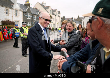 United States Ambassador Robert Wood Johnson meets members of the local community, before a commemoration service at the War Memorial in Port Ellen, Islay, for around 700 First World War soldiers who lost their lives following the sinking of the SS Tuscania and HMS Otranto within eight months of each other in 1918 off of the coast of the small Scottish island. Stock Photo