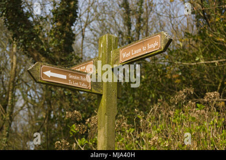 Sign pointing to the Georgian Ride and West Lawn to Jungle in the Lost Gardens of Heligan near St Austell Cornwall Stock Photo