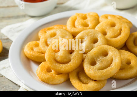 Homemade Smiley Face French Fries with Ketchup Stock Photo