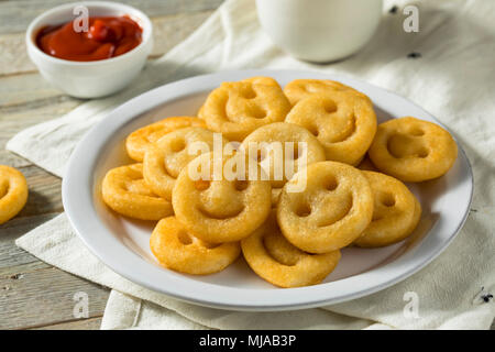 Homemade Smiley Face French Fries with Ketchup Stock Photo