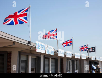 The Union Flag Flying over Beach Food Shops at Littlehampton, West Sussex Stock Photo
