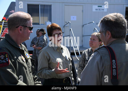 MAFFS is a modular airborne firefighting system operated by military and civilian agencies. The archival photographic record documents annual recertification and media access at McClellan Reload Station in Sacramento. The historical photographic print shows aircrew operations, aircraft fueling, and water tank refilling typical of wildfire response training. Stock Photo