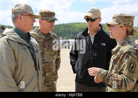 Capt. Brigid Calhoun, 173rd Infantry Brigade Combat Team (Airborne), briefs (from left) Hon. Dr. Bruce Jette, assistant secretary of the Army, Acquisition, Logistics and Technology; Brig. Gen. Joel Tyler, commanding general of the Joint Modernization Command; and Mr. Douglas Wiltsie, director of the Rapid Capabilities Office; Hohenfels, Germany, April 26, 2018. Various military and civilian officials came to Hohenfels to see how the Joint Warfighting Assessment (JWA) helps the Army evaluate emerging concepts, integrate new technologies, and promote interoperability within the Army, with the ot Stock Photo