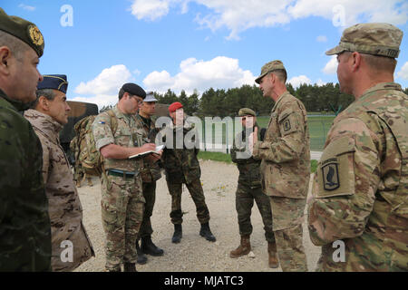 Col. James Bartholomees, Commander of 173rd Infantry Brigade Combat Team (Airborne), briefs multinational distinguished visitors, Hohenfels, Germany, April 26, 2018. Various military and civilian officials came to Hohenfels to see how the Joint Warfighting Assessment (JWA) helps the Army evaluate emerging concepts, integrate new technologies, and promote interoperability within the Army, with the other services, U.S. allies, and partners.  (U.S. Army photo by Staff Sgt. Kalie Frantz) Stock Photo