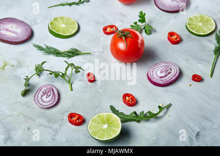 Seamless pattern with lemon, onion, tomatoes, lime and dill on white background, top view, close-up, selective focus, vertical. Vegetables abstract ba Stock Photo