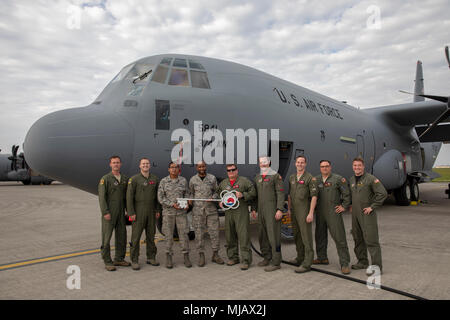 Members of the C-130J Super Hercules number 5843 delivery team pose for a photo at Yokota Air Base, Japan, April 27, 2018. This is the Fourteenth C-130J delivered from Lockheed Martin Aeronautics Company, Ga., and completed its C-130J fleet. (U.S. Air Force photo by Yasuo Osakabe) Stock Photo