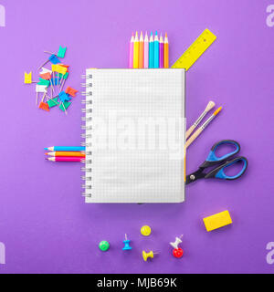 Set of school and preschool childrens accessories for learning letter drawing education on background of violet paper Concept Back to school copy spac Stock Photo